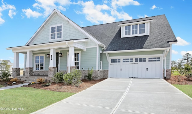 601 Caisson Run, Wilmington, NC 28412 - craftsman-style home with concrete driveway, a porch, a garage, a shingled roof, and a front yard