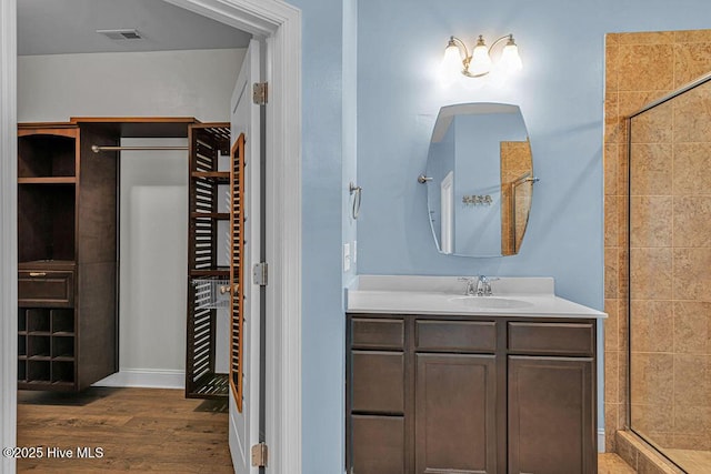 472 Landsdowne Cir, Hampstead, NC 28443 - full bath featuring a shower stall, wood finished floors, and vanity