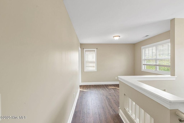 472 Landsdowne Cir, Hampstead, NC 28443 - hall with baseboards, dark wood-style floors, and healthy amount of natural light