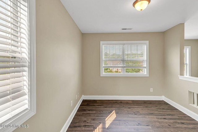 472 Landsdowne Cir, Hampstead, NC 28443 - spare room featuring dark wood-type flooring and baseboards