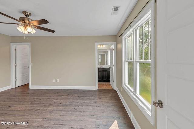 472 Landsdowne Cir, Hampstead, NC 28443 - unfurnished room with baseboards, wood finished floors, and ceiling fan