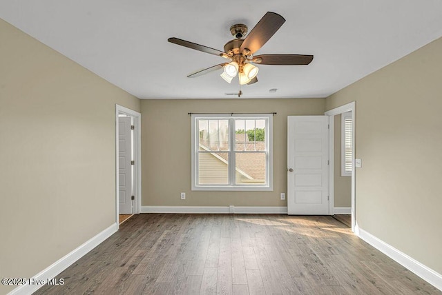 472 Landsdowne Cir, Hampstead, NC 28443 - unfurnished room with ceiling fan, baseboards, and wood finished floors