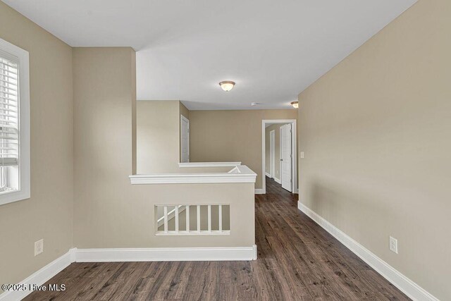 472 Landsdowne Cir, Hampstead, NC 28443 - empty room featuring dark wood finished floors and baseboards