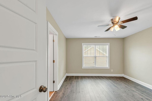 472 Landsdowne Cir, Hampstead, NC 28443 - unfurnished room with a ceiling fan, wood finished floors, and baseboards