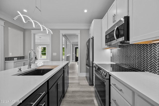 505 N Shore Dr, Sneads Ferry, NC 28460 - kitchen featuring appliances with stainless steel finishes, a sink, light countertops, white cabinets, and recessed lighting