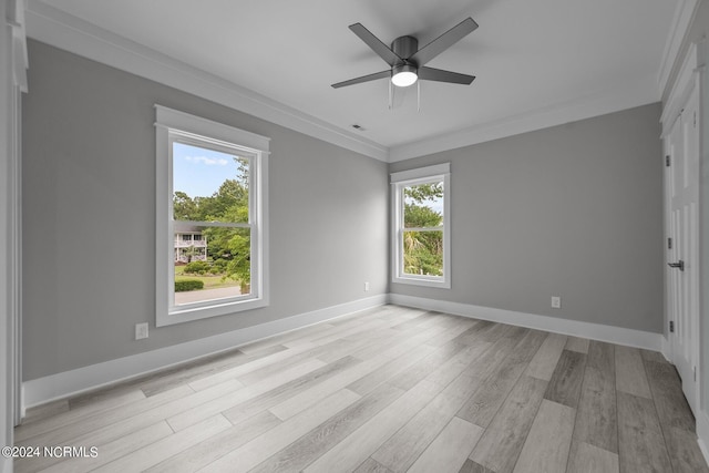 505 N Shore Dr, Sneads Ferry, NC 28460 - unfurnished room featuring healthy amount of natural light, light wood-style flooring, ceiling fan, baseboards, and crown molding
