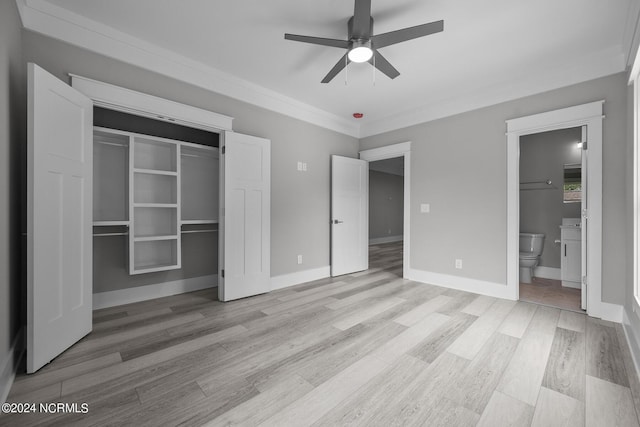 505 N Shore Dr, Sneads Ferry, NC 28460 - unfurnished bedroom featuring light wood-type flooring, a closet, connected bathroom, ornamental molding, and a ceiling fan