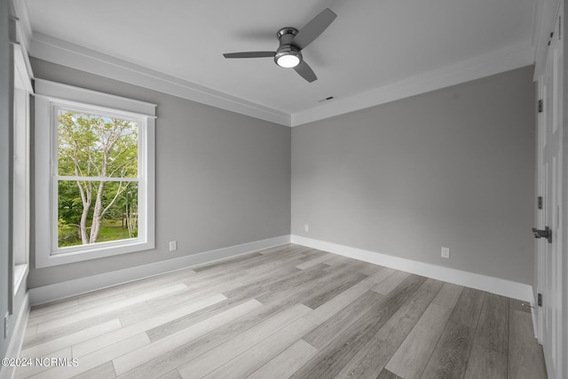 505 N Shore Dr, Sneads Ferry, NC 28460 - spare room with light wood-style floors, a ceiling fan, baseboards, and ornamental molding