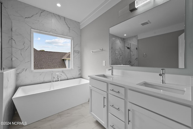 505 N Shore Dr, Sneads Ferry, NC 28460 - bathroom with marble look tiles, a freestanding bath, double vanity, recessed lighting, and a marble finish shower