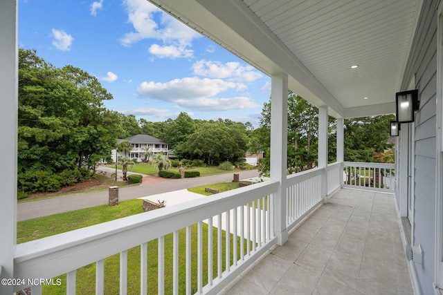 505 N Shore Dr, Sneads Ferry, NC 28460 - porch featuring view of wooded area