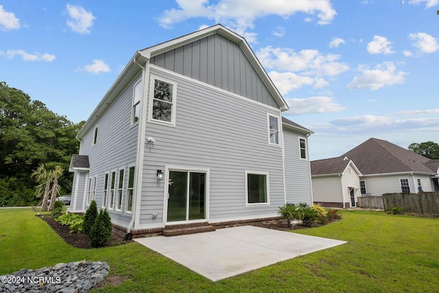 505 N Shore Dr, Sneads Ferry, NC 28460 - back of house featuring board and batten siding and a patio area