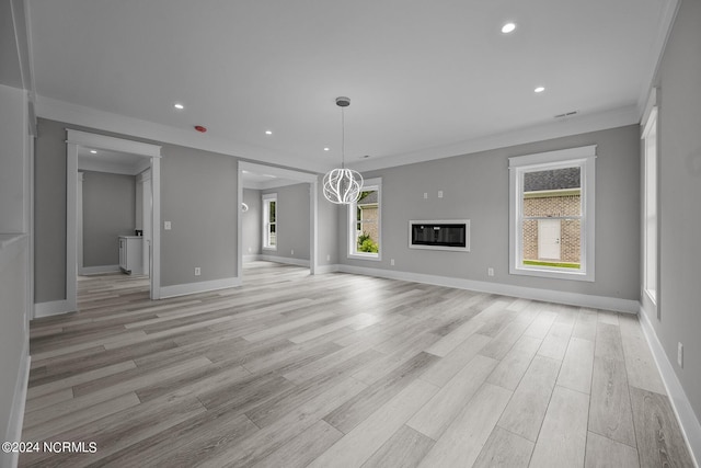 505 N Shore Dr, Sneads Ferry, NC 28460 - unfurnished living room with ornamental molding, recessed lighting, baseboards, and light wood finished floors