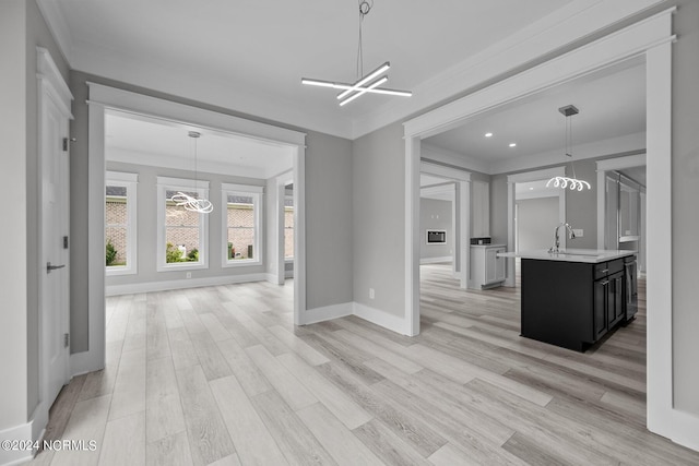505 N Shore Dr, Sneads Ferry, NC 28460 - kitchen featuring a chandelier, light countertops, dark cabinets, a sink, and recessed lighting