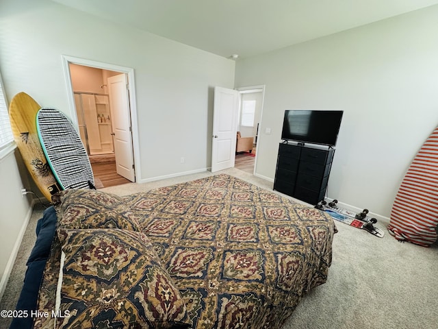 18 Landward Way, Wilmington, NC 28411 - carpeted bedroom featuring baseboards and connected bathroom