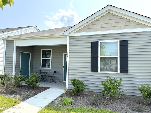 18 Landward Way, Wilmington, NC 28411 - view of front of home featuring covered porch and a shingled roof