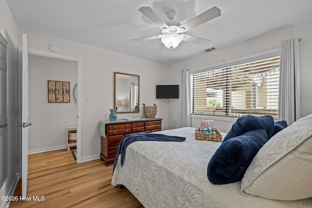 9100 Reed Dr Unit 3107, Emerald Isle, NC 28594 - bedroom featuring light wood finished floors, baseboards, and ceiling fan
