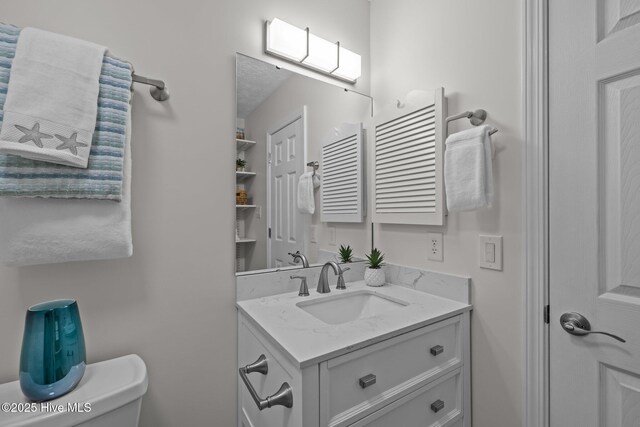 9100 Reed Dr Unit 3107, Emerald Isle, NC 28594 - bathroom featuring vanity and toilet