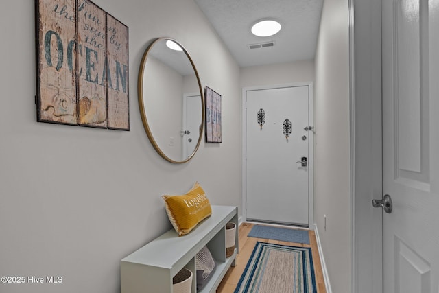 9100 Reed Dr Unit 3107, Emerald Isle, NC 28594 - doorway featuring wood finished floors and baseboards