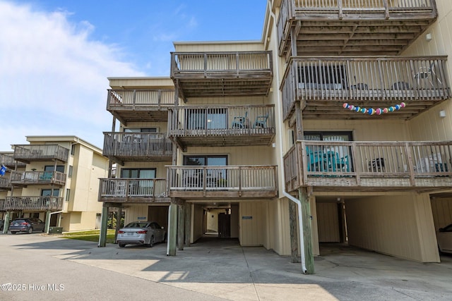 9100 Reed Dr Unit 3107, Emerald Isle, NC 28594 - view of building exterior featuring a carport