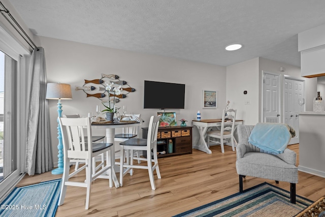 9100 Reed Dr Unit 3107, Emerald Isle, NC 28594 - living area with light wood-style floors and a textured ceiling