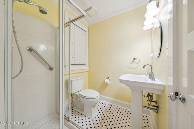 217 N 18th St, Wilmington, NC 28405 - full bathroom featuring a shower stall, baseboards, toilet, and crown molding