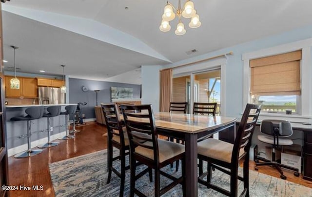 100 Mercedes Ct Unit F, Grandy, NC 27939 - dining space featuring lofted ceiling, wood finished floors, a chandelier, and baseboards