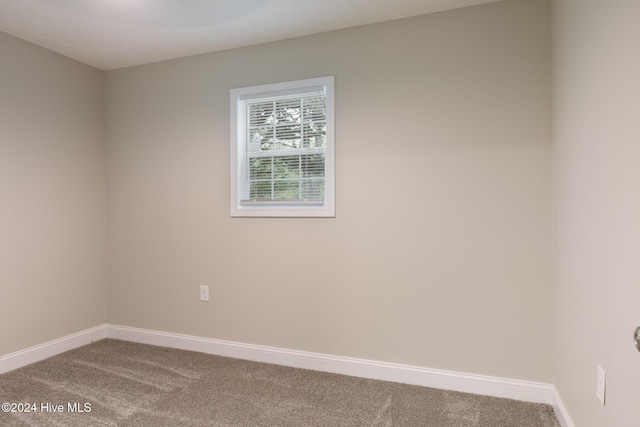 212 Tram Rd, West End, NC 27376 - carpeted empty room with baseboards