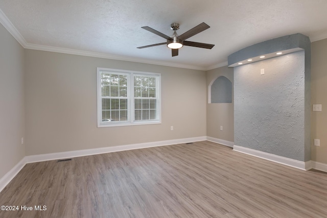 212 Tram Rd, West End, NC 27376 - empty room featuring a ceiling fan, wood finished floors, ornamental molding, a textured ceiling, and baseboards