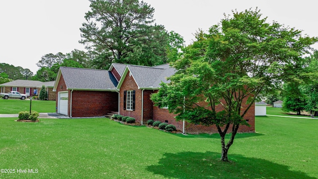 103 Loblolly Dr, Plymouth, NC 27962 - view of front of home with brick siding, a front lawn, an attached garage, and a shingled roof