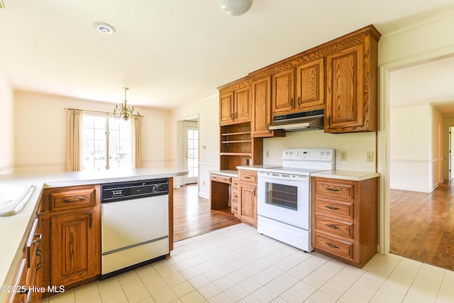 103 Loblolly Dr, Plymouth, NC 27962 - kitchen with white appliances, under cabinet range hood, a chandelier, brown cabinets, and light countertops