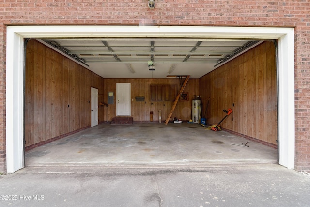 103 Loblolly Dr, Plymouth, NC 27962 - garage with water heater, wooden walls, and a garage door opener