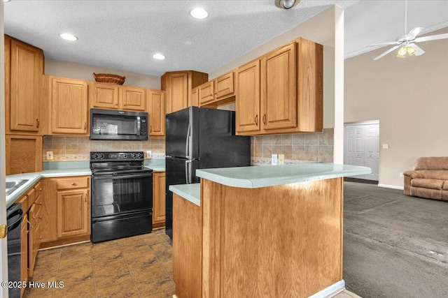 734 Sloop Pointe Ln, Kure Beach, NC 28449 - kitchen featuring black appliances, light countertops, backsplash, a ceiling fan, and a peninsula
