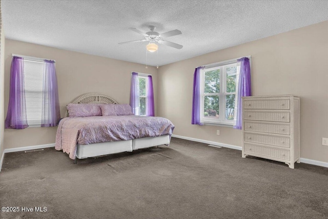734 Sloop Pointe Ln, Kure Beach, NC 28449 - bedroom with carpet floors, baseboards, ceiling fan, and a textured ceiling