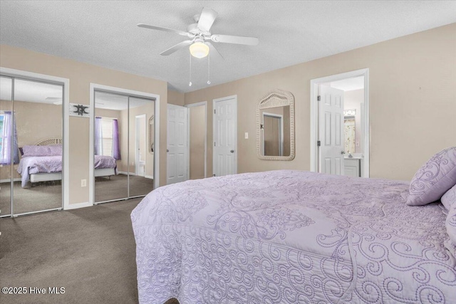 734 Sloop Pointe Ln, Kure Beach, NC 28449 - carpeted bedroom featuring two closets, ensuite bath, baseboards, a textured ceiling, and a ceiling fan