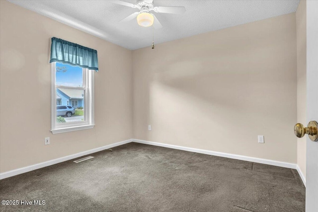 734 Sloop Pointe Ln, Kure Beach, NC 28449 - empty room with carpet, baseboards, a ceiling fan, and a textured ceiling