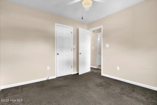 734 Sloop Pointe Ln, Kure Beach, NC 28449 - unfurnished bedroom with baseboards, dark carpet, and ceiling fan