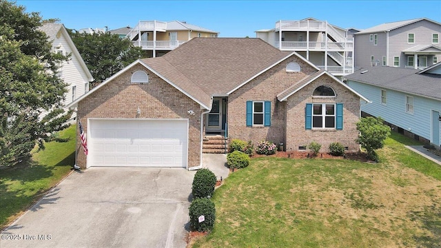 734 Sloop Pointe Ln, Kure Beach, NC 28449 - traditional home with brick siding, an attached garage, driveway, and a front yard