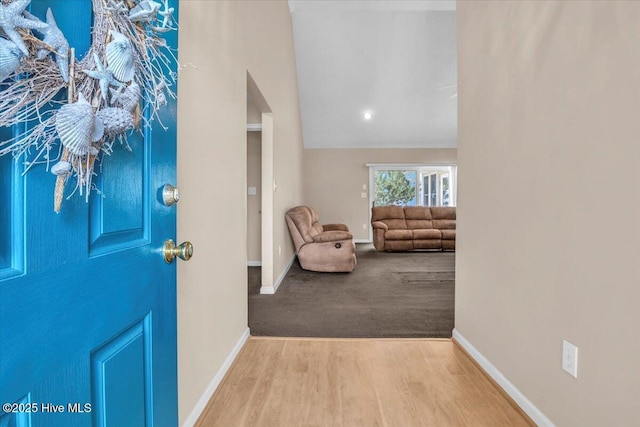 734 Sloop Pointe Ln, Kure Beach, NC 28449 - foyer with baseboards and wood finished floors