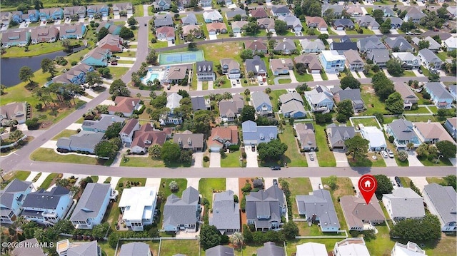 734 Sloop Pointe Ln, Kure Beach, NC 28449 - aerial view of property and surrounding area featuring nearby suburban area and a large body of water