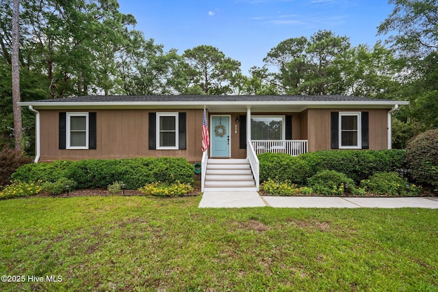 114 Mohican Trl, Wilmington, NC 28409 - ranch-style house featuring a front lawn and covered porch