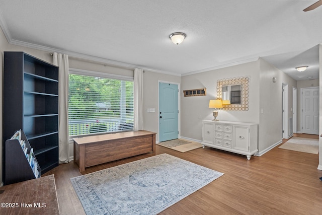 114 Mohican Trl, Wilmington, NC 28409 - entrance foyer featuring ornamental molding, wood finished floors, baseboards, and a textured ceiling