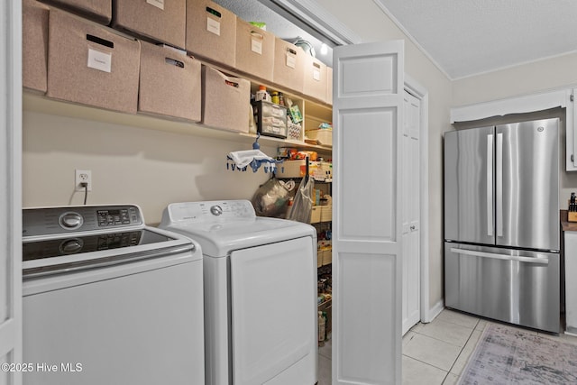 114 Mohican Trl, Wilmington, NC 28409 - laundry area with washer and dryer, light tile patterned floors, and ornamental molding