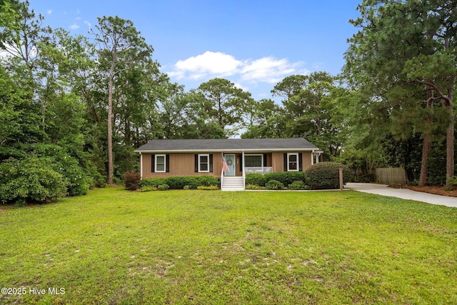 114 Mohican Trl, Wilmington, NC 28409 - view of front of property with a front yard and concrete driveway