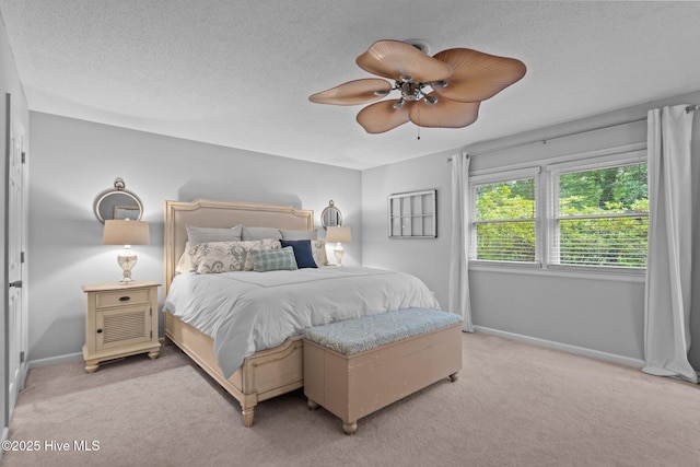 114 Mohican Trl, Wilmington, NC 28409 - bedroom with light colored carpet, baseboards, ceiling fan, and a textured ceiling