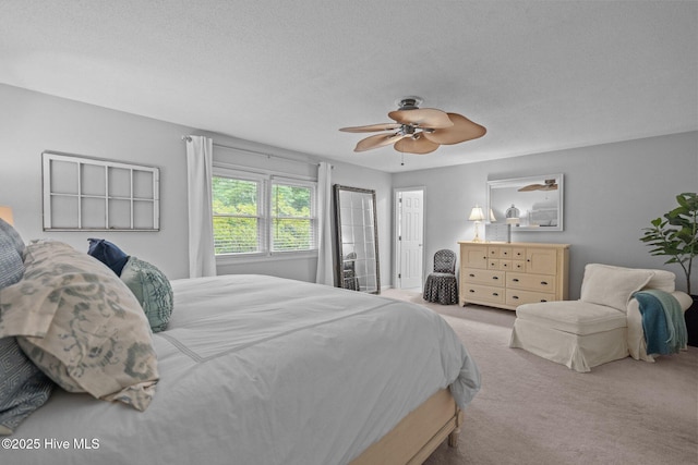 114 Mohican Trl, Wilmington, NC 28409 - bedroom with carpet floors, a ceiling fan, and a textured ceiling