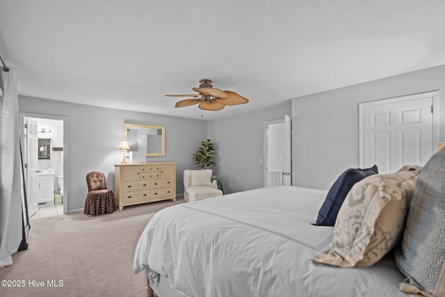 114 Mohican Trl, Wilmington, NC 28409 - carpeted bedroom featuring connected bathroom and a ceiling fan