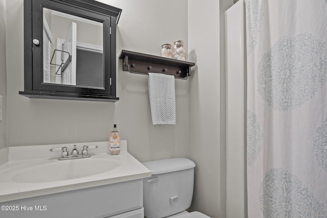 114 Mohican Trl, Wilmington, NC 28409 - bathroom with vanity, toilet, and a shower with curtain