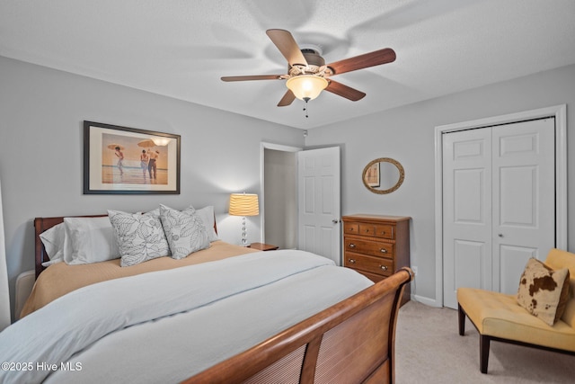 114 Mohican Trl, Wilmington, NC 28409 - bedroom featuring light carpet, a closet, and a ceiling fan