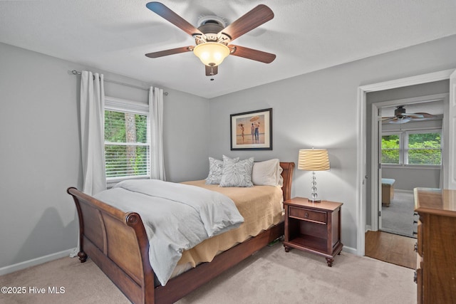 114 Mohican Trl, Wilmington, NC 28409 - bedroom with carpet floors, multiple windows, and baseboards