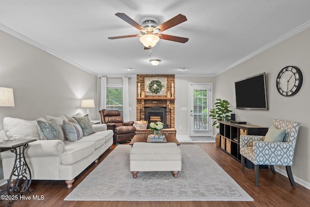 114 Mohican Trl, Wilmington, NC 28409 - living area with ornamental molding, ceiling fan, wood finished floors, a brick fireplace, and baseboards